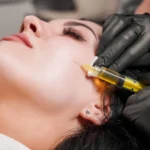 female-doctor-making-injection-woman-chin