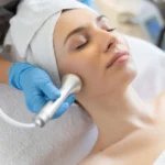 young-woman-lying-cosmetologist-s-table-rejuvenation-procedure-cosmetologist-take-care-about-neck-face-skin-youthfull-wellness-hardware-face-cleaning-procedure