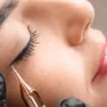 young-woman-undergoing-procedure-permanent-eye-makeup-tattoo-salon-closeup